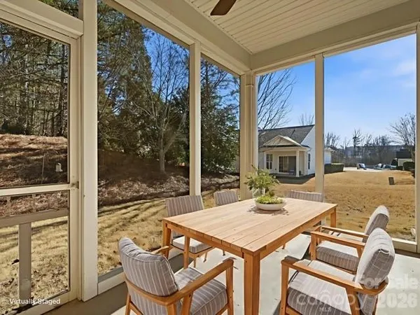 a view of a living room and floor to ceiling window