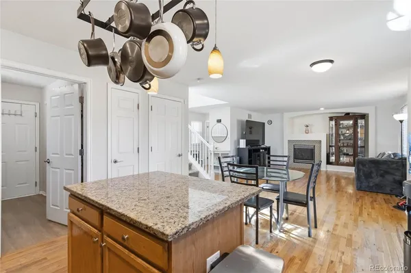 a view of kitchen and dining area with wooden floor