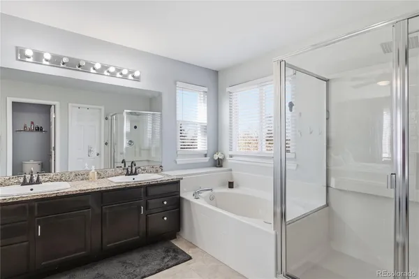 a white bath tub sitting next to a white sink