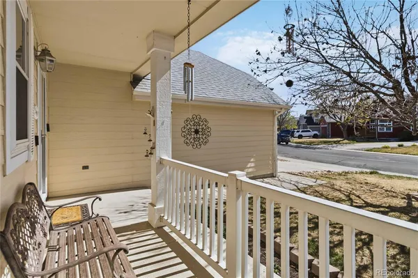 a view of a house with a wooden fence