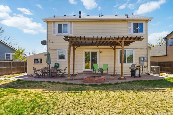 a view of a roof deck with wooden fence and floor