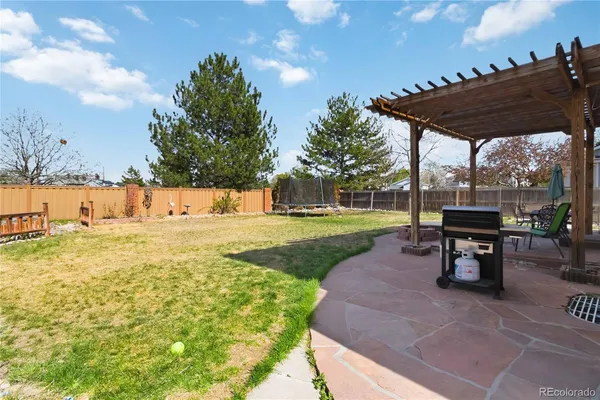a view of a house with backyard porch and sitting area
