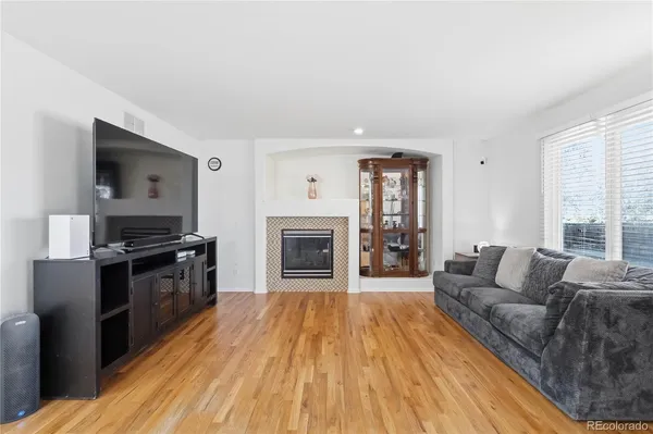 a living room with a couch and a fireplace