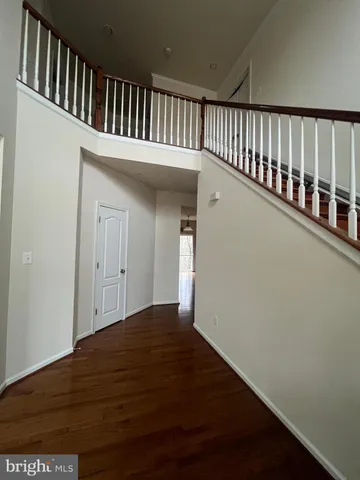 a kitchen with stainless steel appliances granite countertop a refrigerator and a stove
