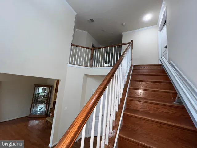 a kitchen with stainless steel appliances granite countertop wooden cabinets a stove top oven a sink and dishwasher