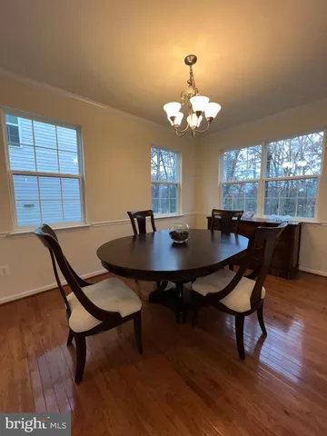 a bathroom with a double vanity sink a mirror and a bathtub