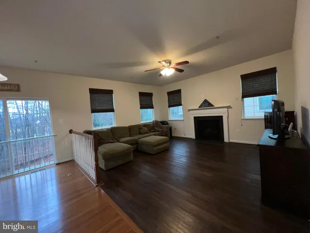 an empty room with a empty space and windows