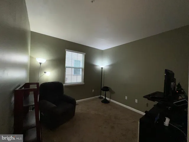 a bathroom with a sink vanity mirror and toilet