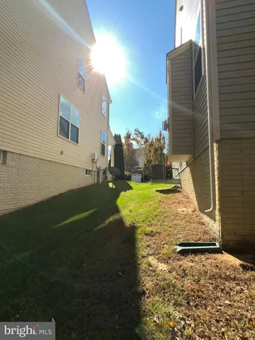 a view of staircase with wooden floor and a rug