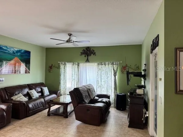 a living room with furniture and a window