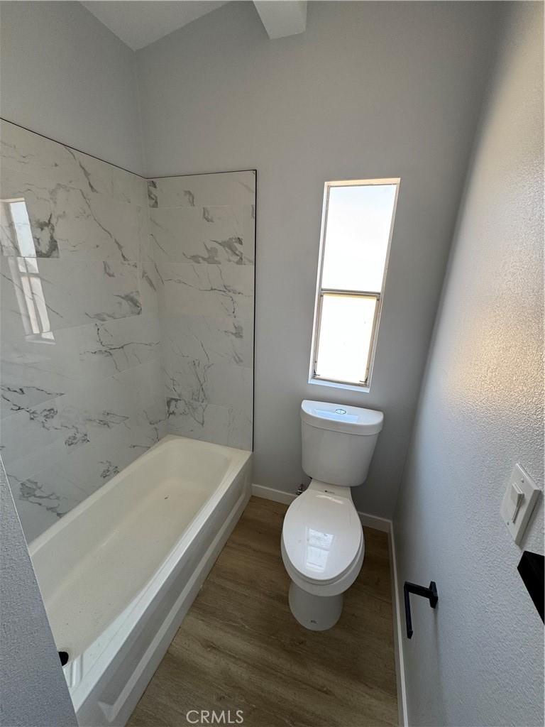 15030 Fairlane Road Lucerne Valley, CA 92356 - Photo 17 of 18 a bathroom with a toilet a sink and bathtub