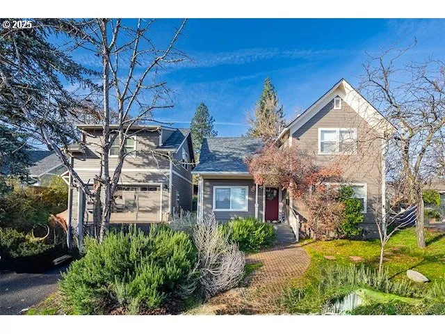 a front view of a house with garden