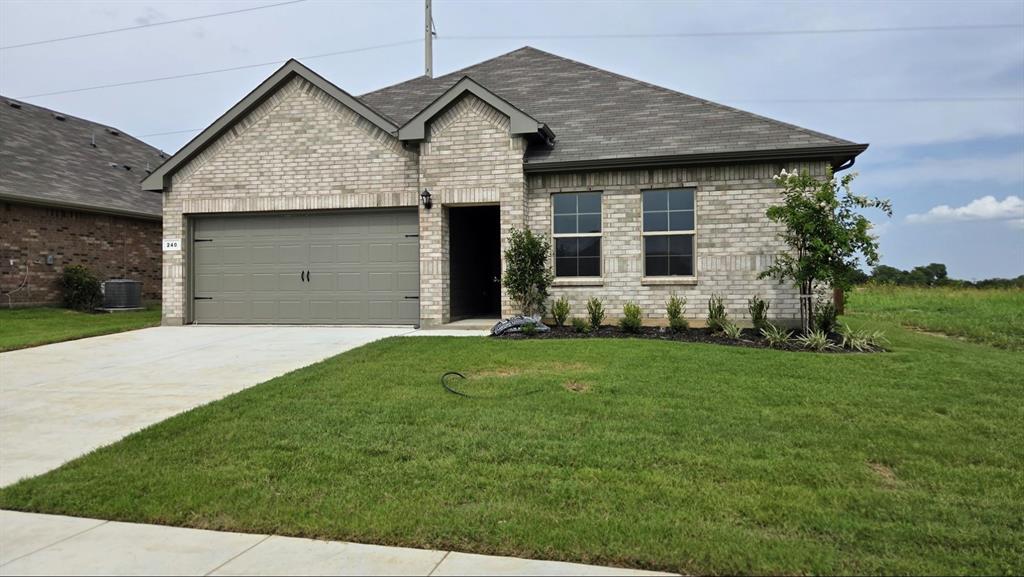 240 Kinley Street Grandview, TX 76050 - Photo 13 of 15 a view of a house with backyard and garden