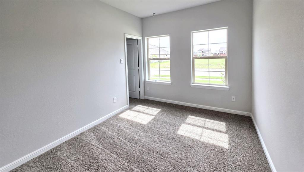 240 Kinley Street Grandview, TX 76050 - Photo 10 of 15 an empty room with windows