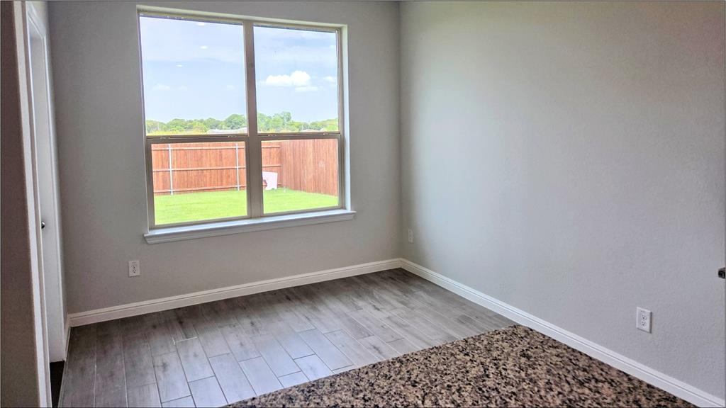 240 Kinley Street Grandview, TX 76050 - Photo 2 of 15 a view of an empty room with a window