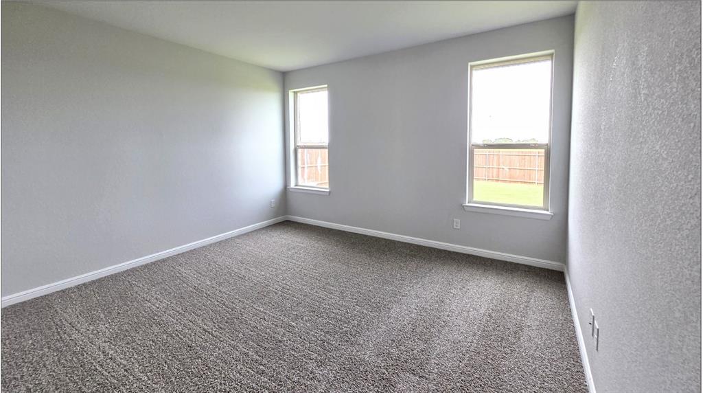 240 Kinley Street Grandview, TX 76050 - Photo 4 of 15 an empty room with a window
