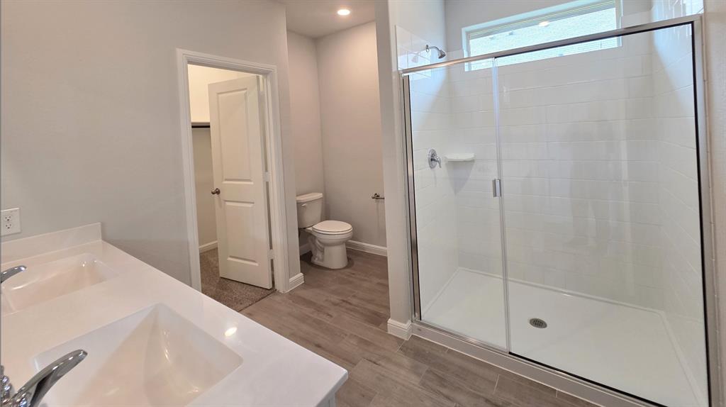 240 Kinley Street Grandview, TX 76050 - Photo 5 of 15 a bathroom with a shower and a toilet