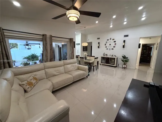 a kitchen with a stove and white cabinets