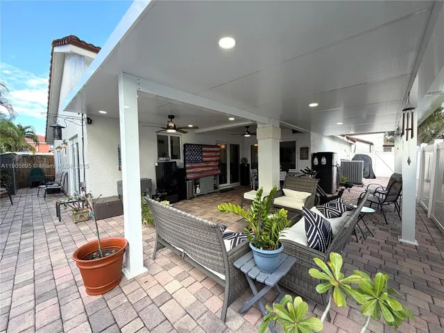a view of a room with wooden floor and a chair