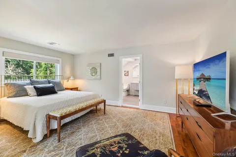 a bedroom with a bed and a desk