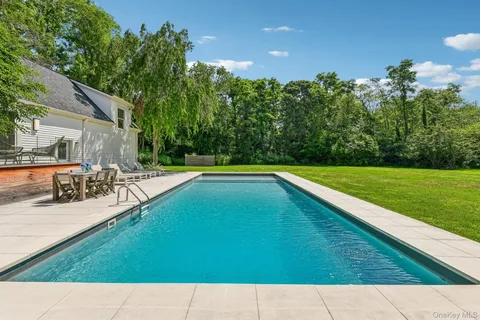 a view of swimming pool with a patio