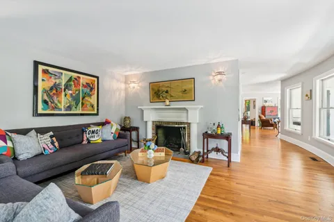 a view of a dining room with furniture wooden floor and chandelier