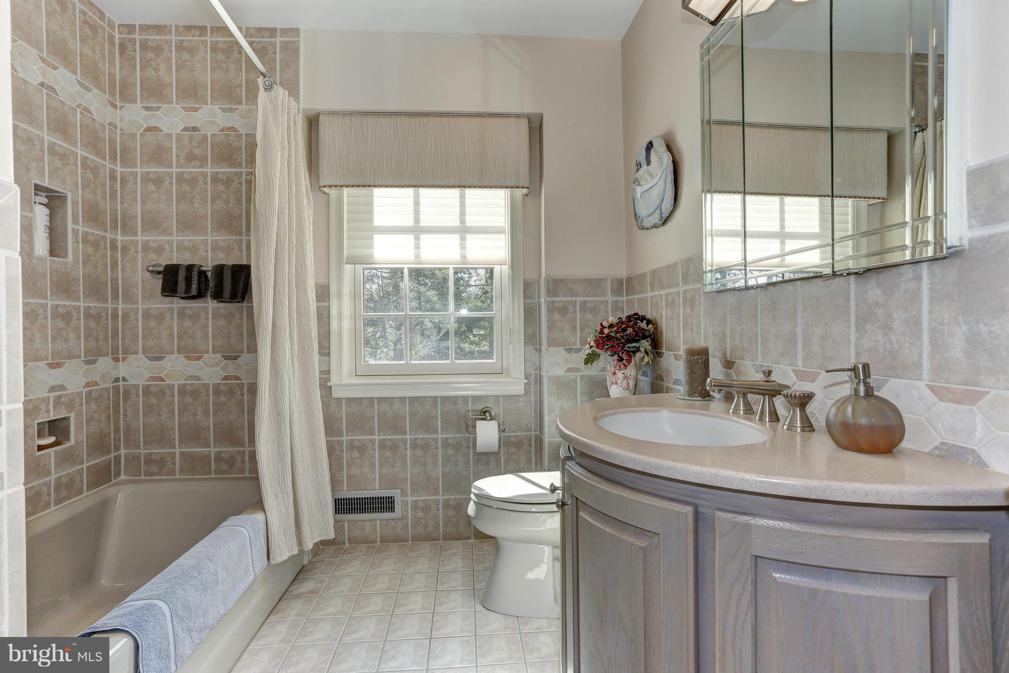 7918 Ruxway Road Baltimore, MD 21204 - Photo 22 of 30 Renovated hall bath with heated floor.