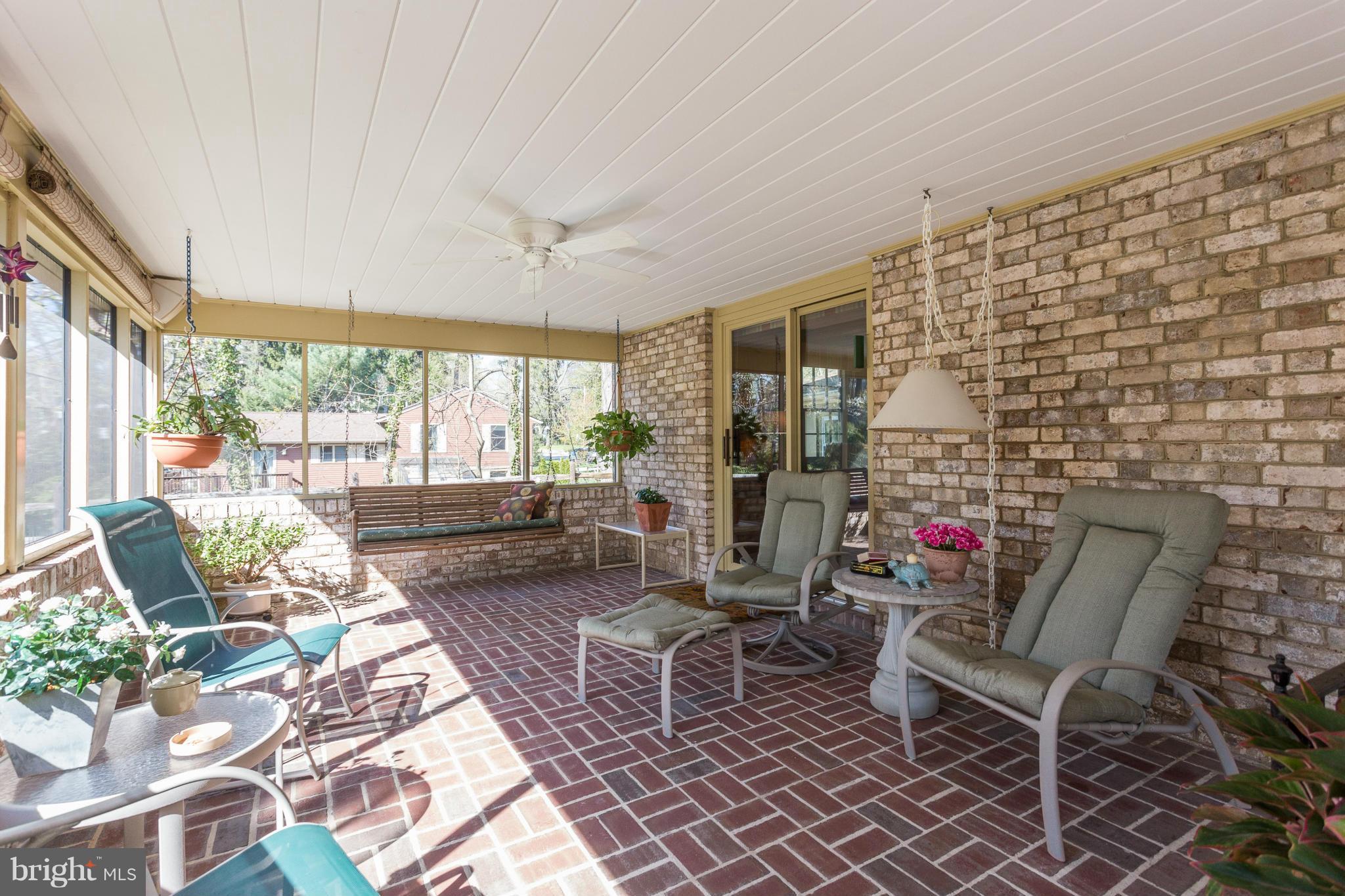 7918 Ruxway Road Baltimore, MD 21204 - Photo 4 of 30 Stunning screened porch with brick floor.