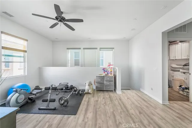 a bed room with furniture and a window