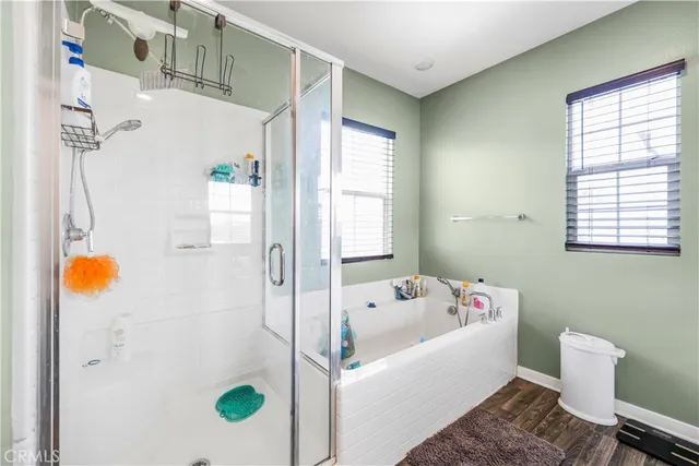 a bathroom with a bathtub and shower