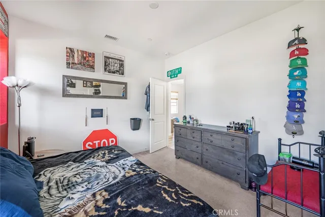 a bedroom with furniture and a bed