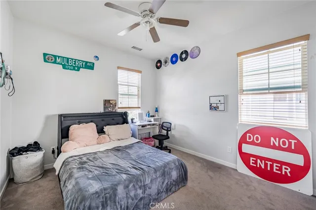 a bedroom with a bed and a table