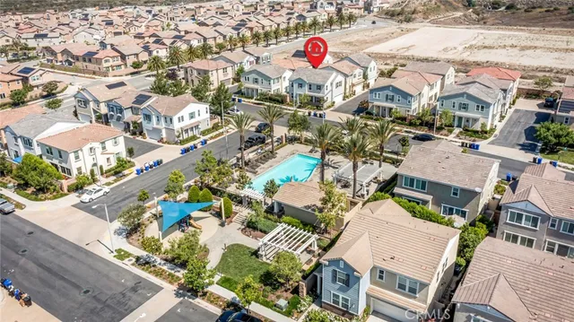 an aerial view of residential houses with outdoor space