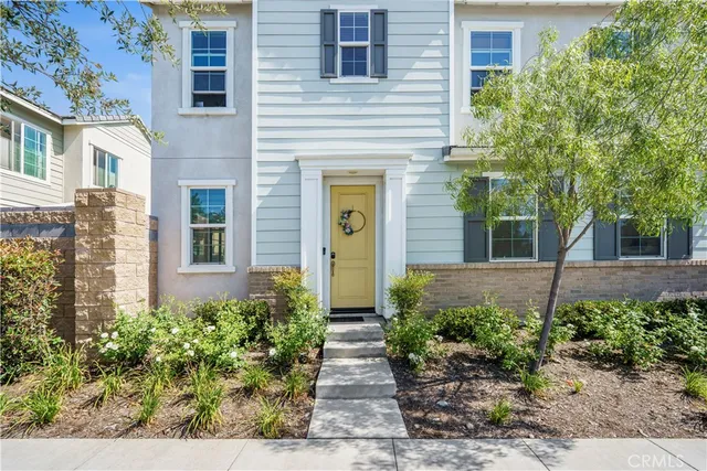 a view of a pathway both side of the house