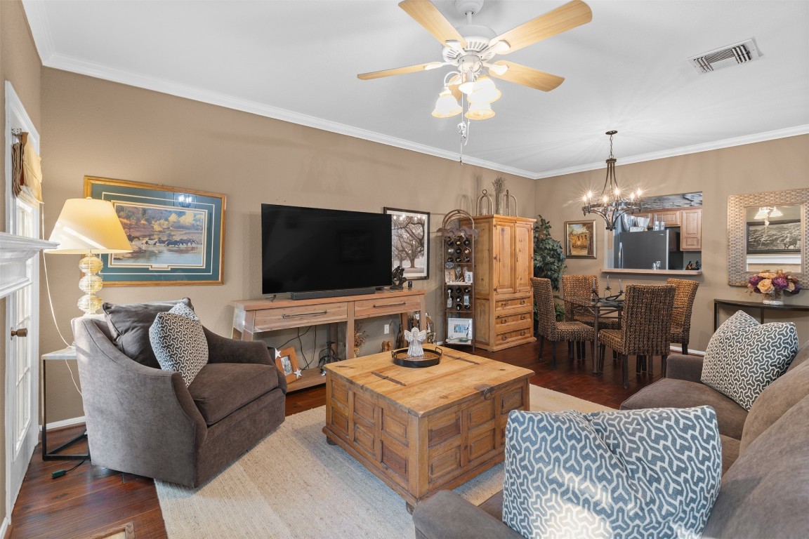 6000 Reims Road, Unit 2307 Houston, TX 77036 - Photo 4 of 26 The space seamlessly connects to a dining area, and the kitchen is visible through a pass-through window. Perfect for relaxing and entertaining.