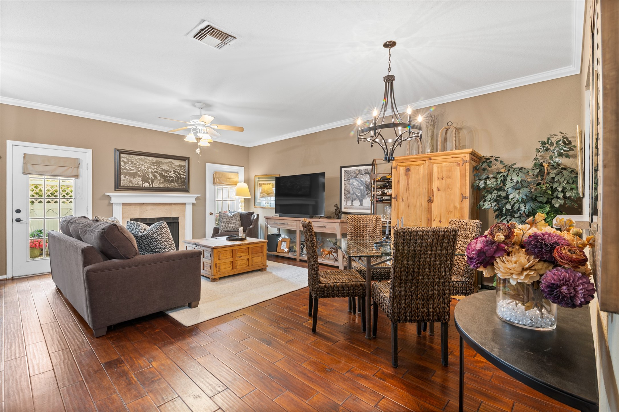 6000 Reims Road, Unit 2307 Houston, TX 77036 - Photo 7 of 26 This inviting living area features tasteful lighting and a fireplace, with patio doors that allow natural light and access to your private patio.