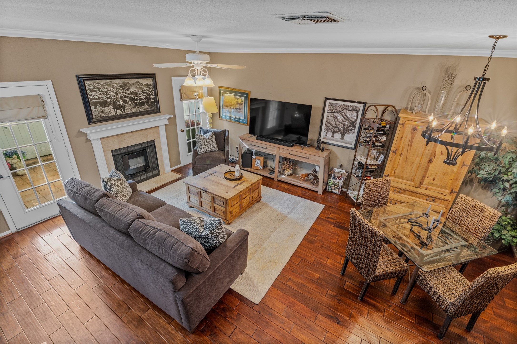 6000 Reims Road, Unit 2307 Houston, TX 77036 - Photo 8 of 26 Natural light enters through French doors, enhancing the inviting ambiance.