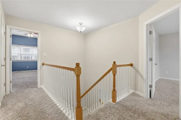 a view of a hallway view with staircase