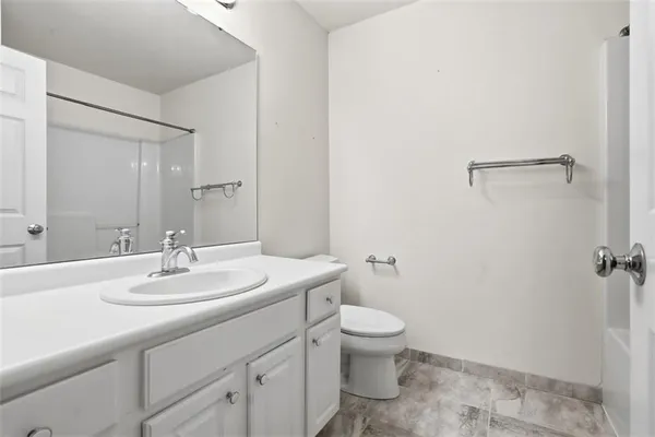 a bathroom with a sink toilet and vanity