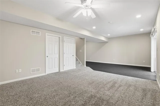a view of a house with a door and wooden floor