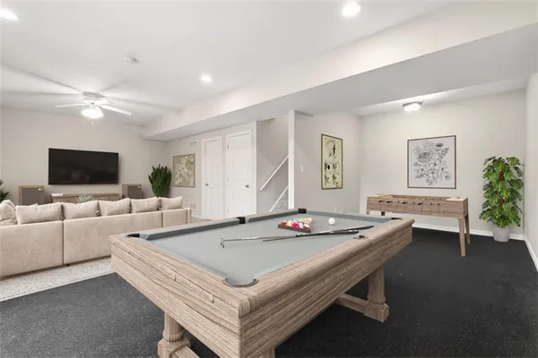 an empty room with a ceiling fan and a window