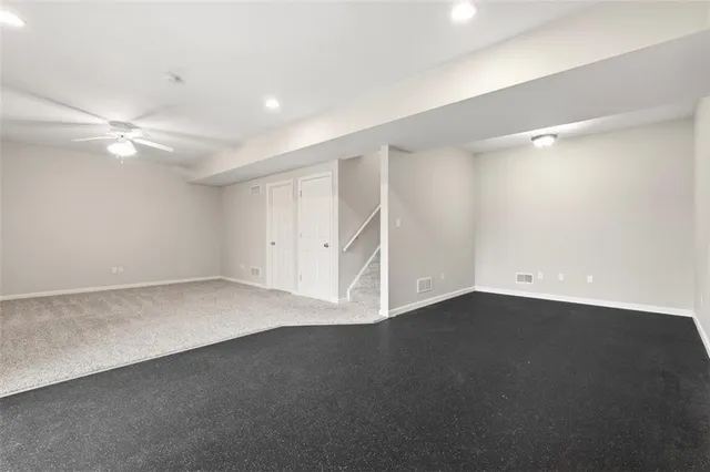 a view of a big house in the middle of a yard