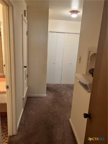 a view of a storage & utility room with a sink