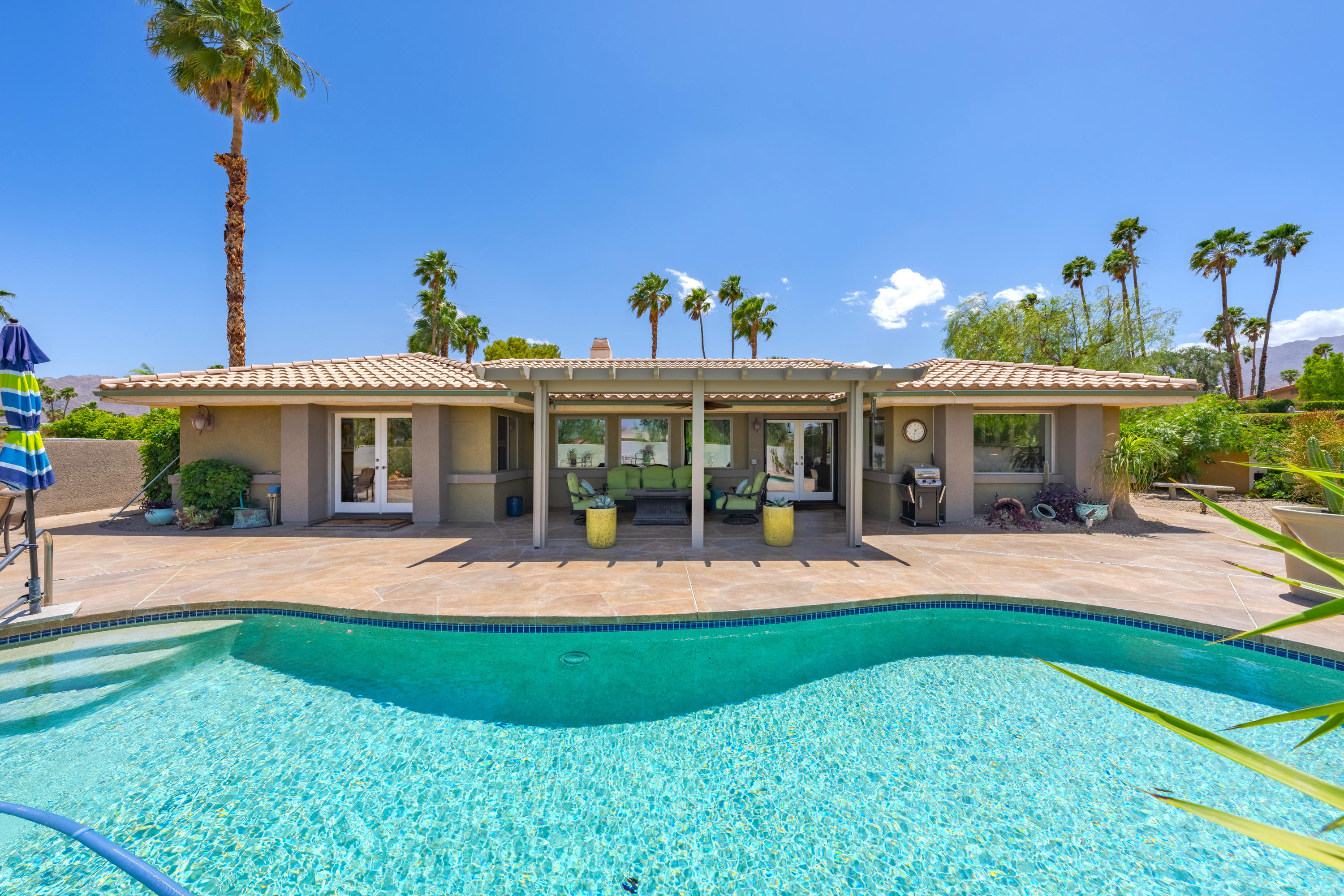 73005 Haystack Road Palm Desert, CA 92260 - Photo 2 of 45 front view of a house with a yard