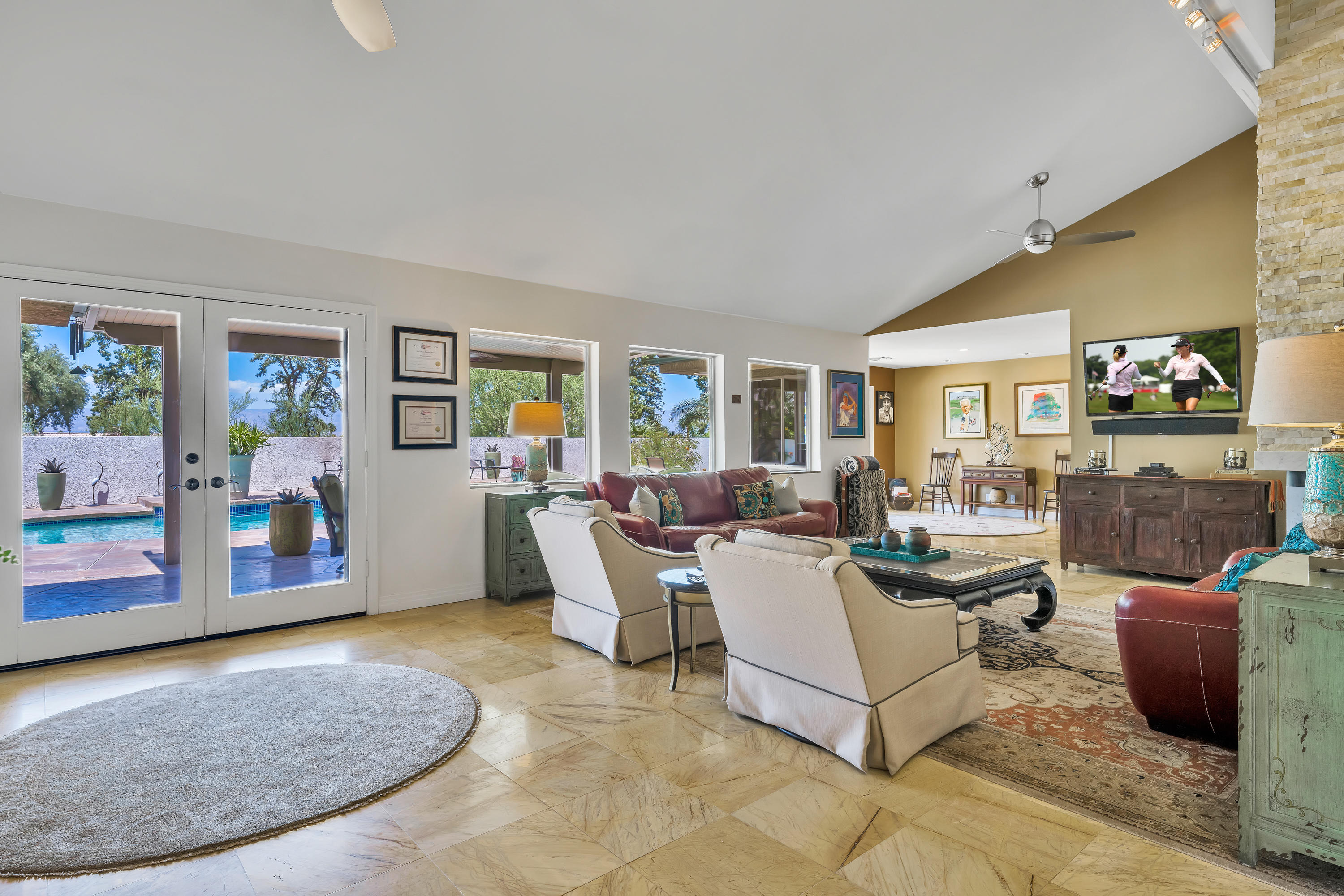 73005 Haystack Road Palm Desert, CA 92260 - Photo 12 of 45 a living room with furniture and a flat screen tv