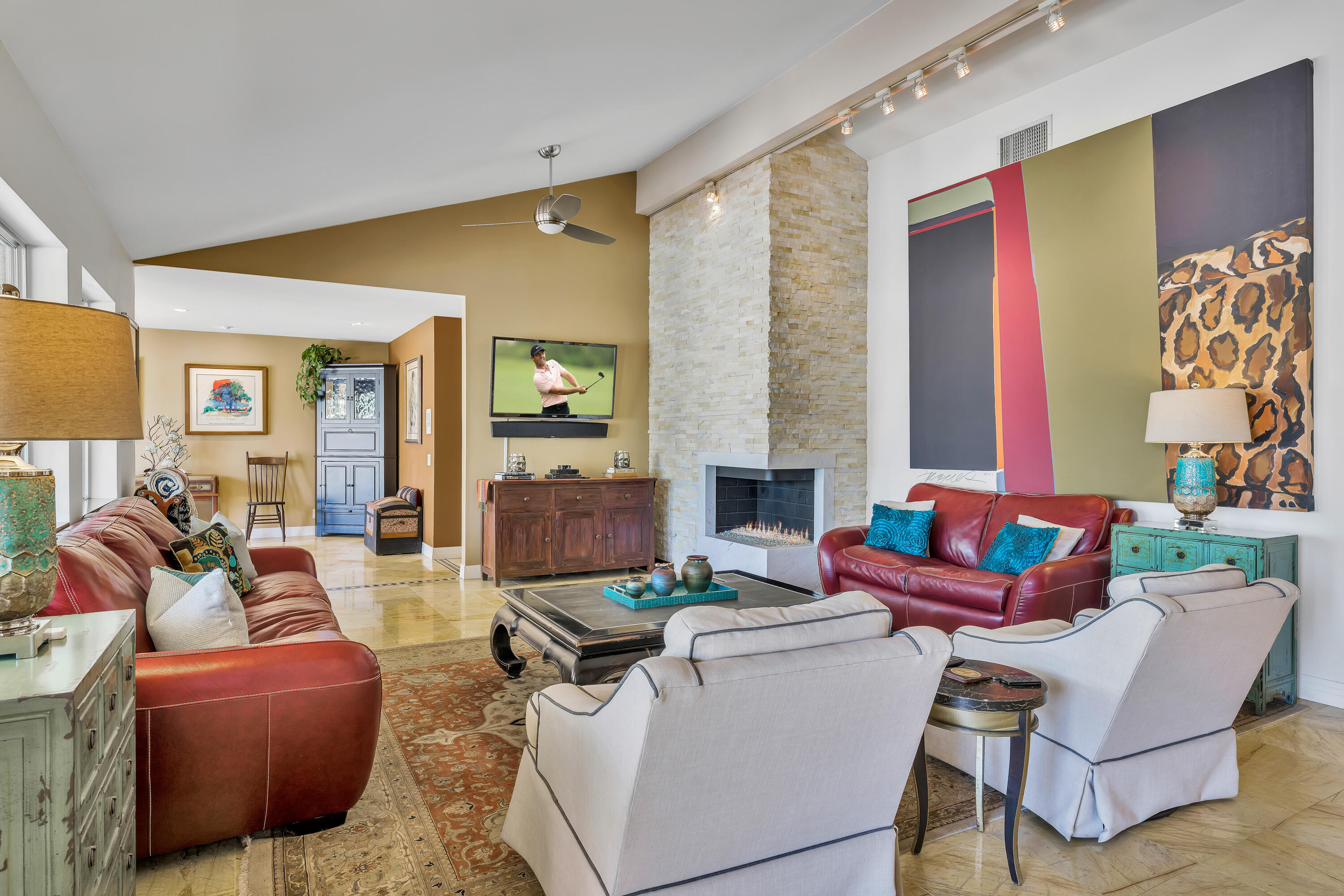 73005 Haystack Road Palm Desert, CA 92260 - Photo 13 of 45 a living room with fireplace furniture and a potted plant