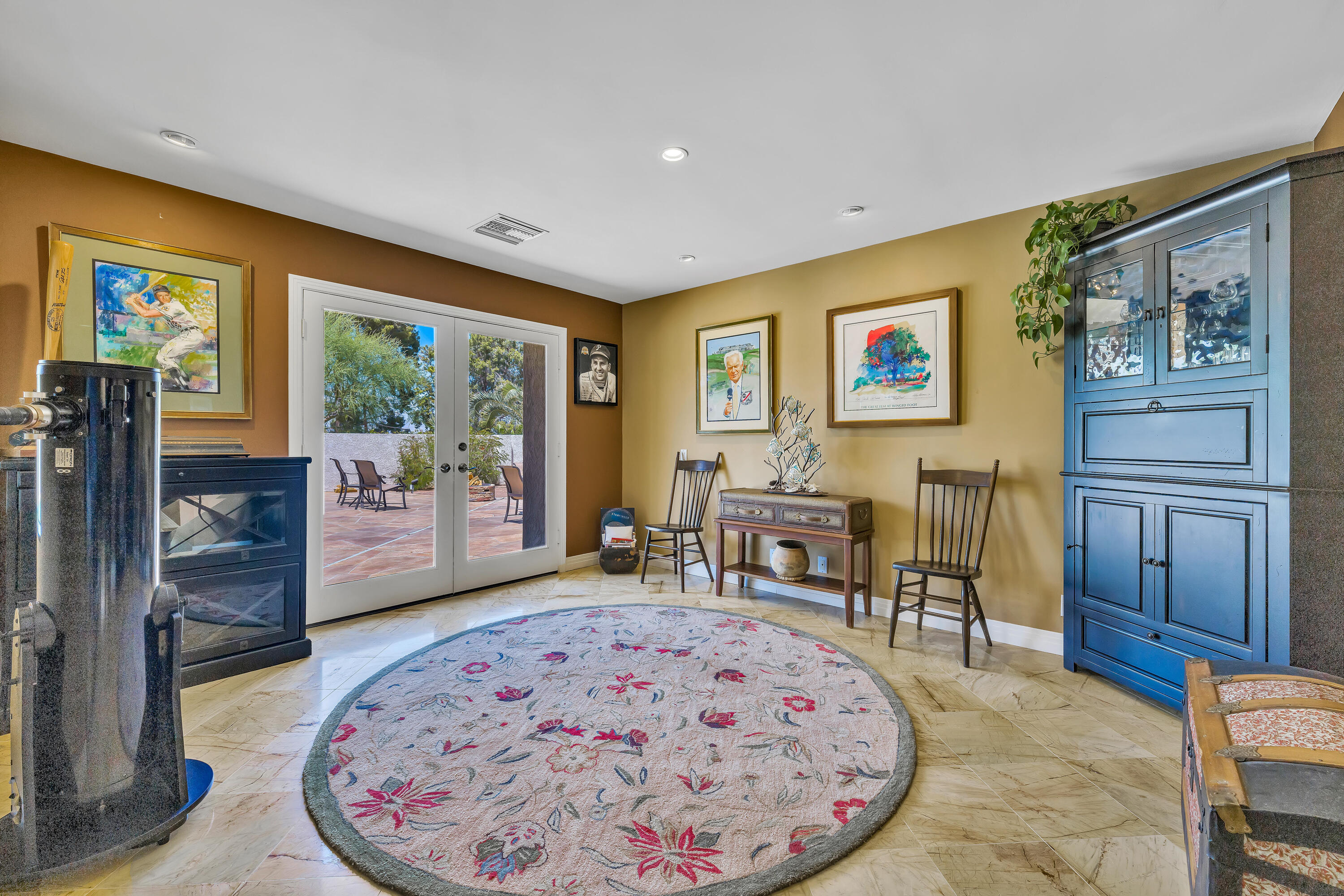 73005 Haystack Road Palm Desert, CA 92260 - Photo 15 of 45 a living room with furniture a large window and a dining table