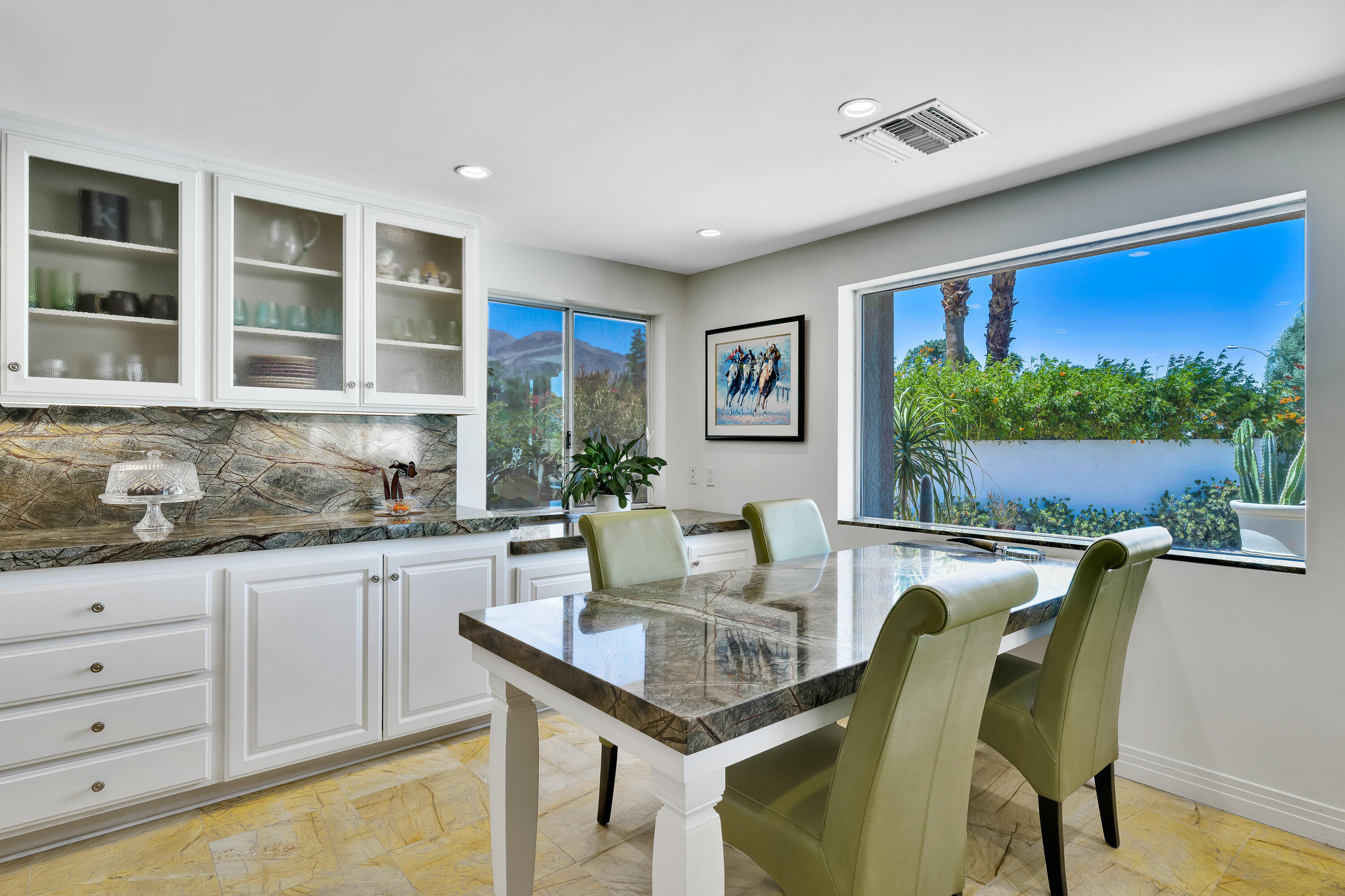 73005 Haystack Road Palm Desert, CA 92260 - Photo 18 of 45 a living room with granite countertop furniture and a potted plant