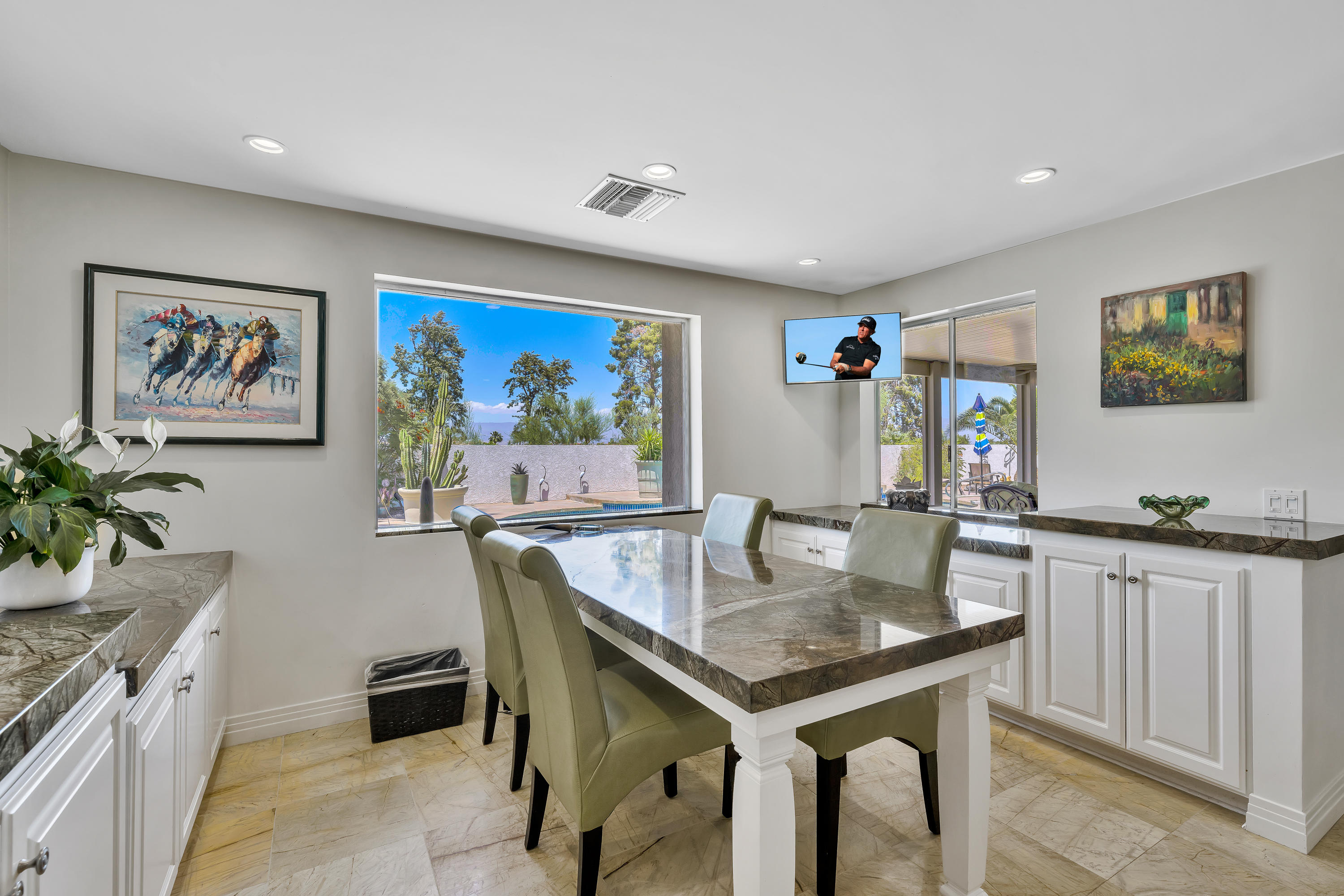 73005 Haystack Road Palm Desert, CA 92260 - Photo 19 of 45 a view of a kitchen area with furniture and wooden floor