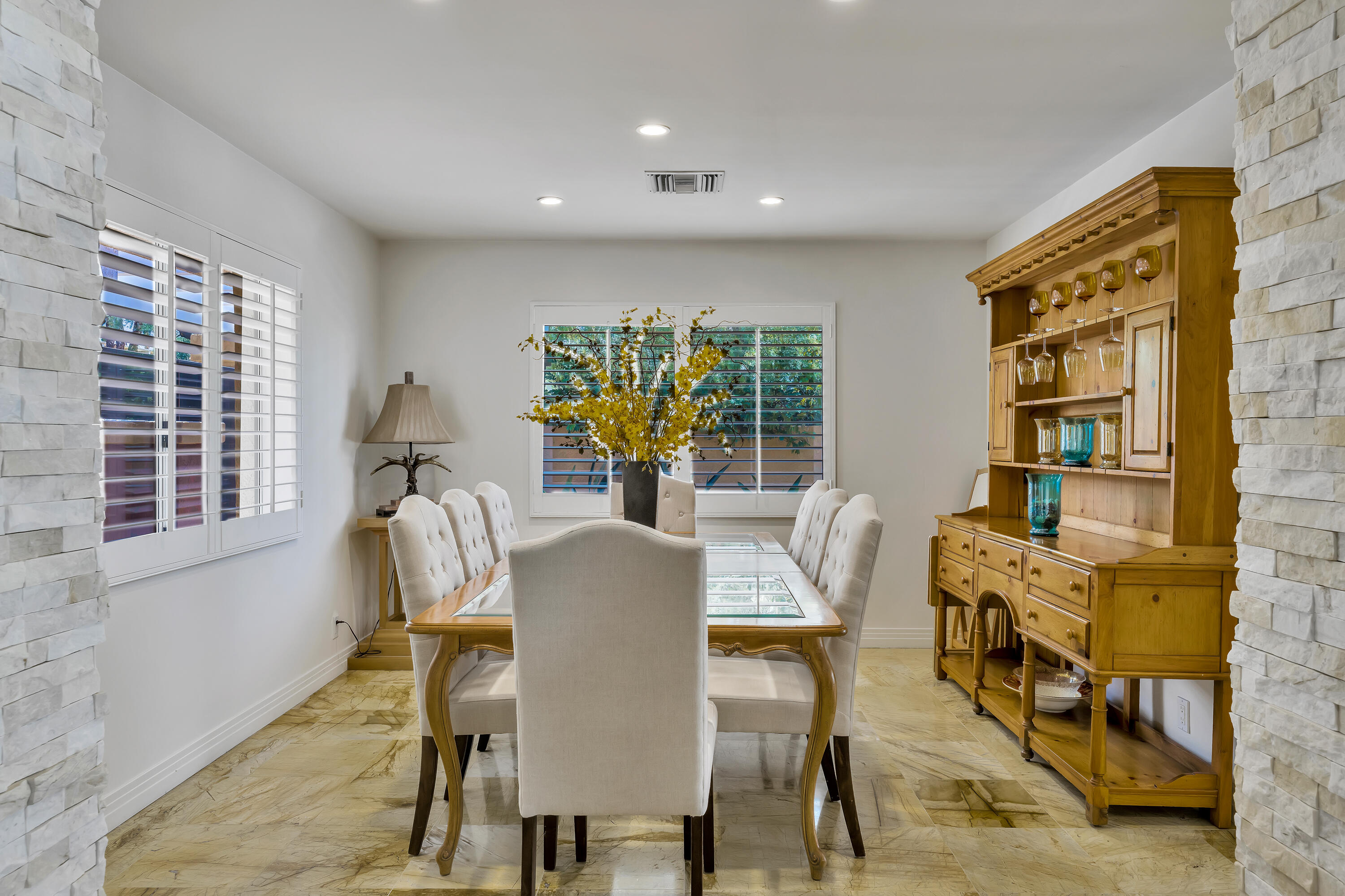 73005 Haystack Road Palm Desert, CA 92260 - Photo 25 of 45 a view of a dining room with furniture and window